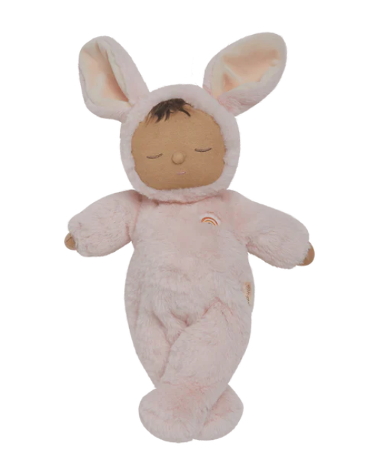 Plush toy baby doll dressed in a pink bunny outfit on a white background