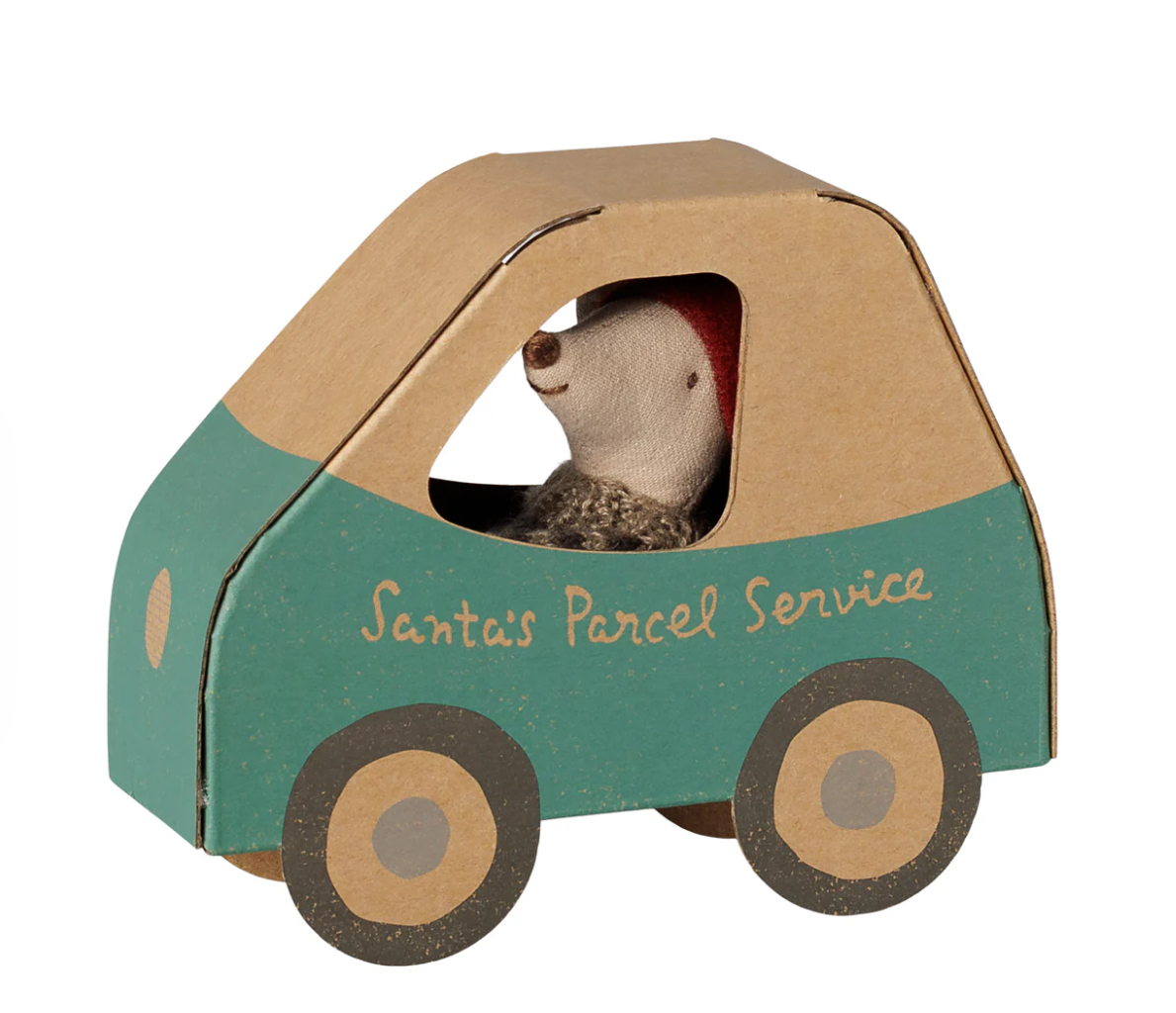 Maileg little brother mouse inside a cardboard toy car with the words "Santa's Parcel Service" on it