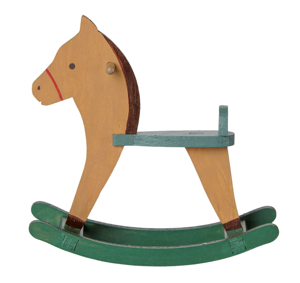 Miniature wooden toy rocking horse in light brown with green base, on a white background