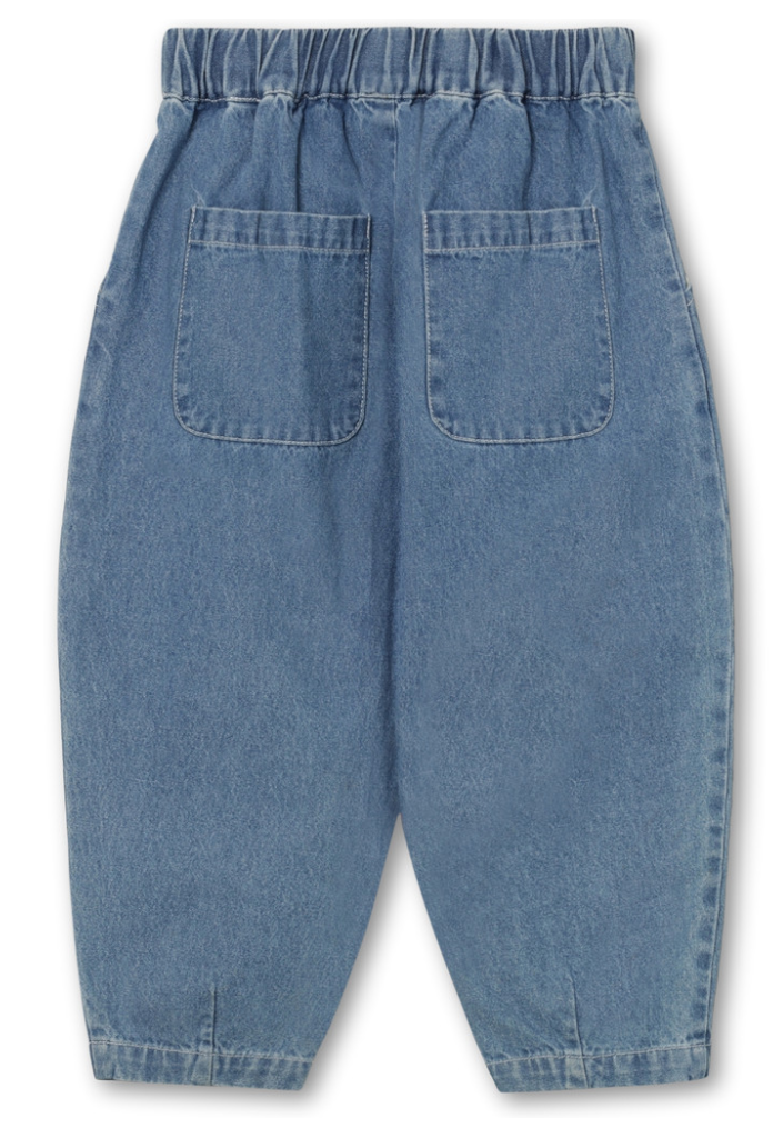 Back view of denim pants with elasticized waist, with two back pockets, tapered at ankles.
