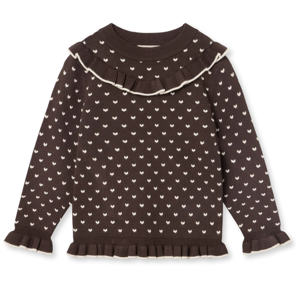 A dark brown long-sleeve knit sweater for toddlers, featuring a white repeating heart pattern, a wide ruffled collar, and ruffled trim at the cuffs and hem, shown against a plain white background.