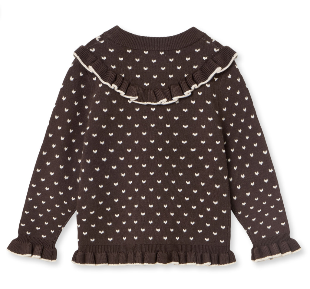 A dark brown long-sleeve knit sweater with a repeating cream pattern of small hearts and a large ruffled collar, finished with matching ruffled cuffs and hem.