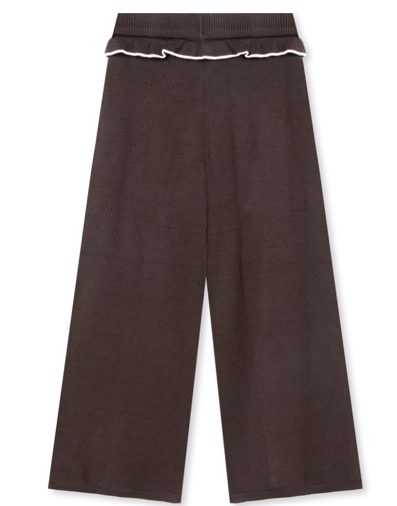 Dark brown knit wide-leg pants featuring a ruffled elastic waistband with a white trim accent.