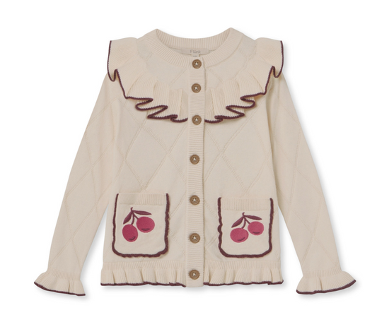 Ivory children's cardigan sweater with buttons down the front, a ruffle collar, sleeves and front pockets, edged in brown, with appliqued cherries on the pockets