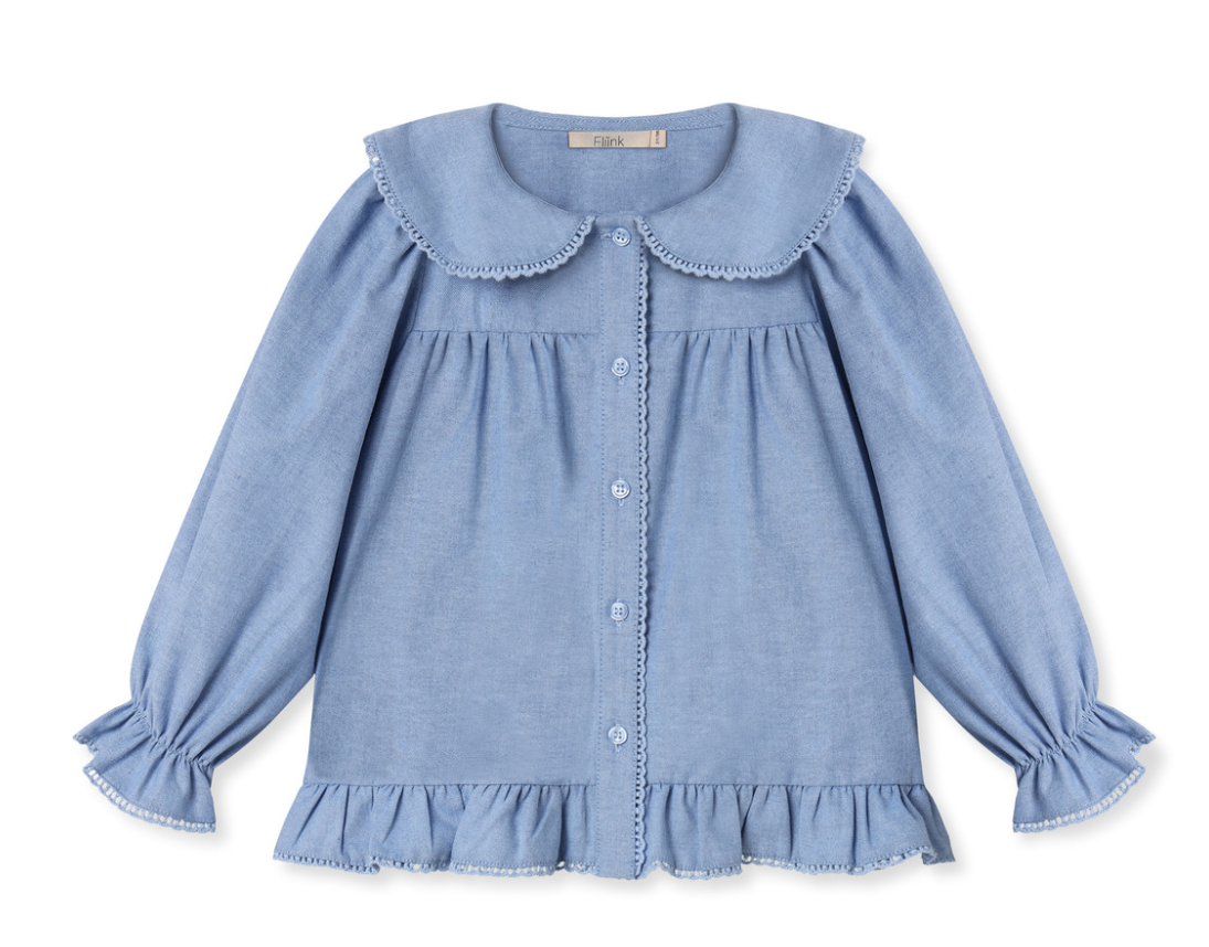 Long Sleeve medium blue top with peter pan collar, buttons down the front and a ruffle hem on bottom and bottom of sleeves
