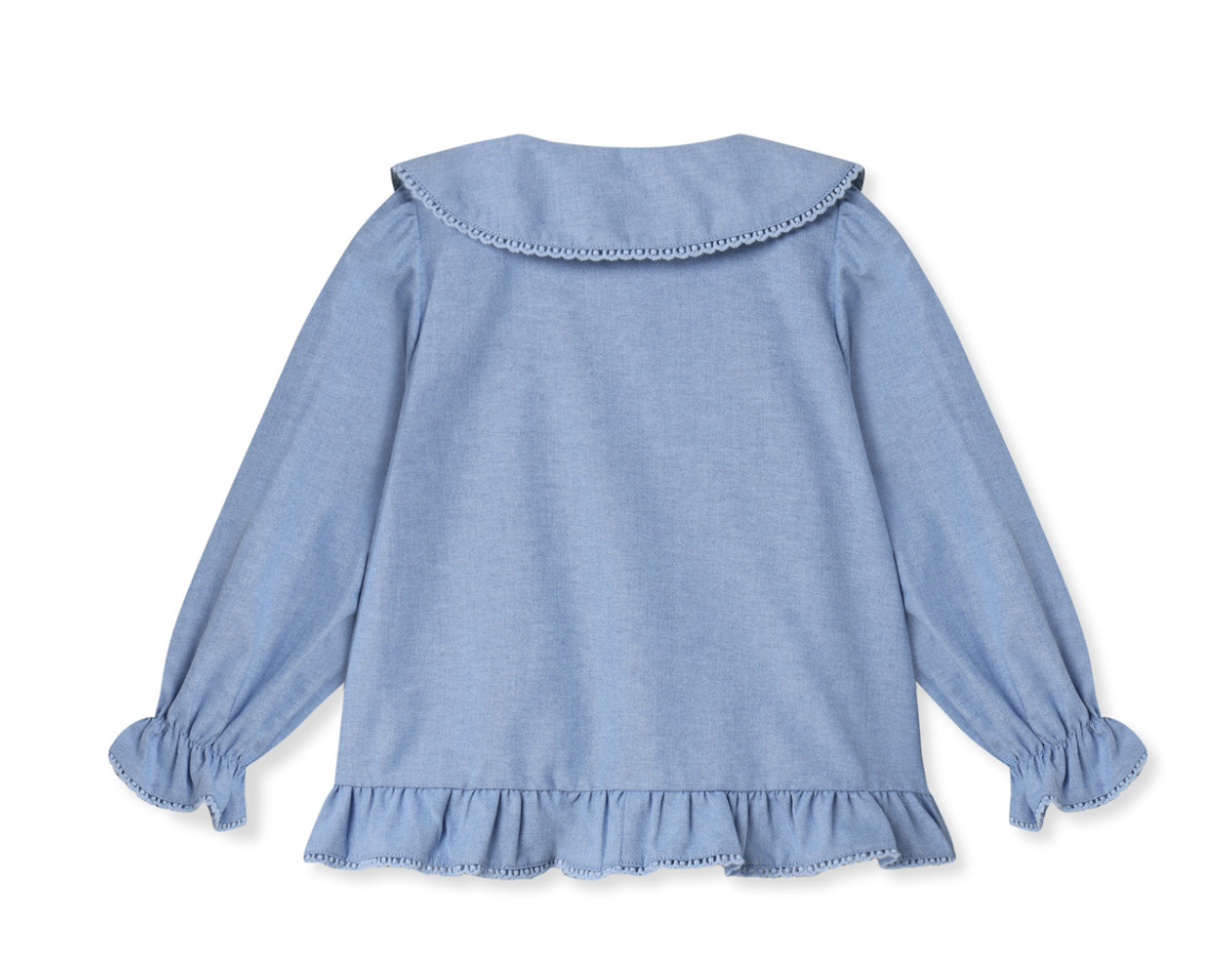 Back of long Sleeve medium blue top with peter pan collar, buttons down the front and a ruffle hem on bottom and bottom of sleeves