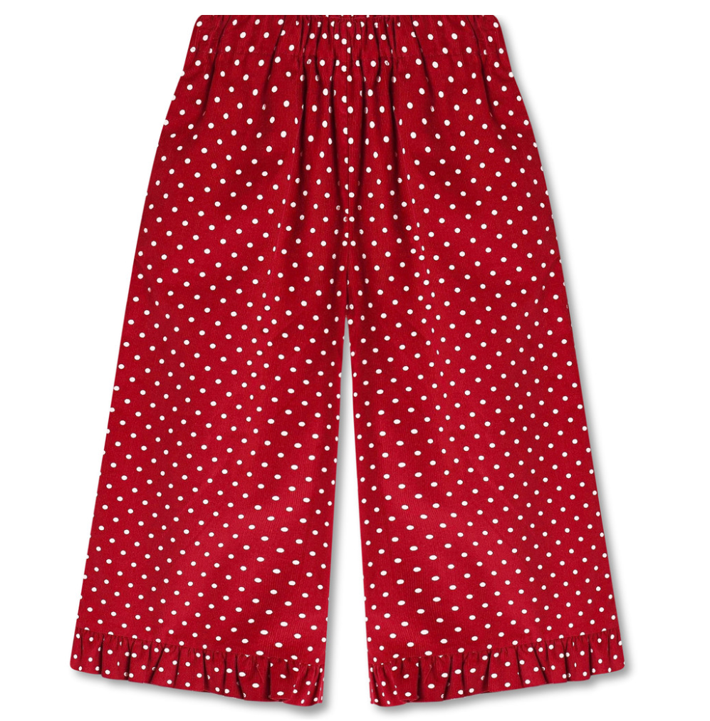 Red wide leg pants with white polka dots and a ruffle at the hem on a white background