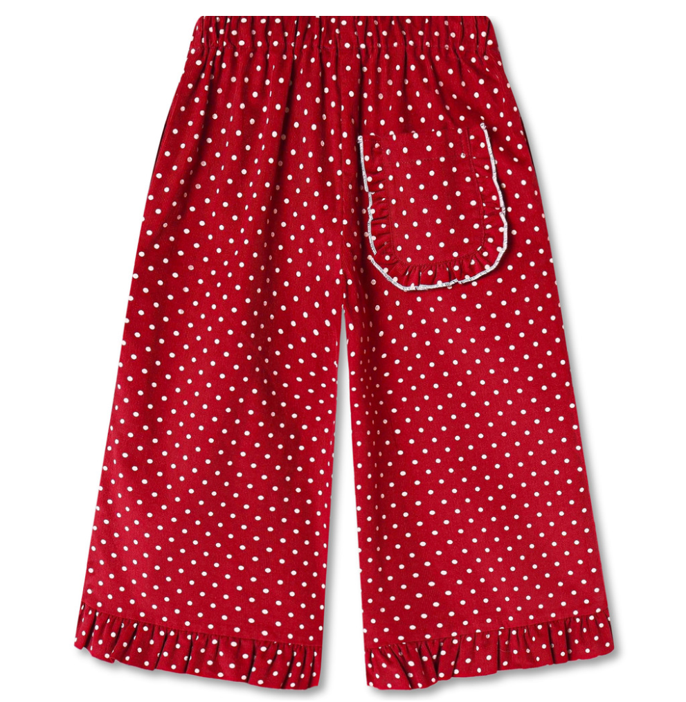 Red wide leg pants with white polka dots and a ruffle at the hem and a ruffled back pocket