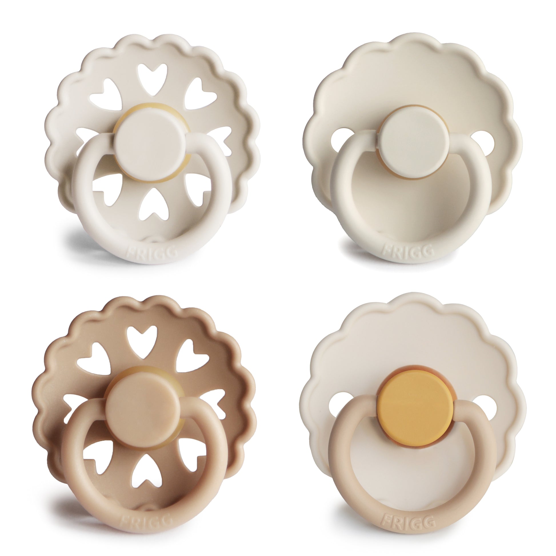 Four baby pacifiers in beige, white, and brown on a white background