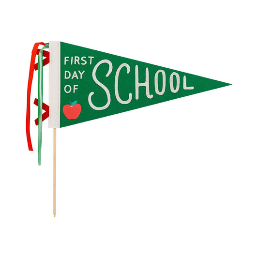 Green pennant with “first day of school” message 
