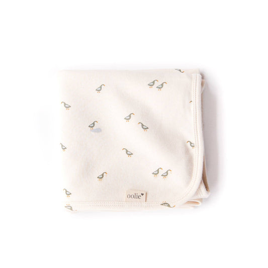 Baby blanket with duck pattern on a white background