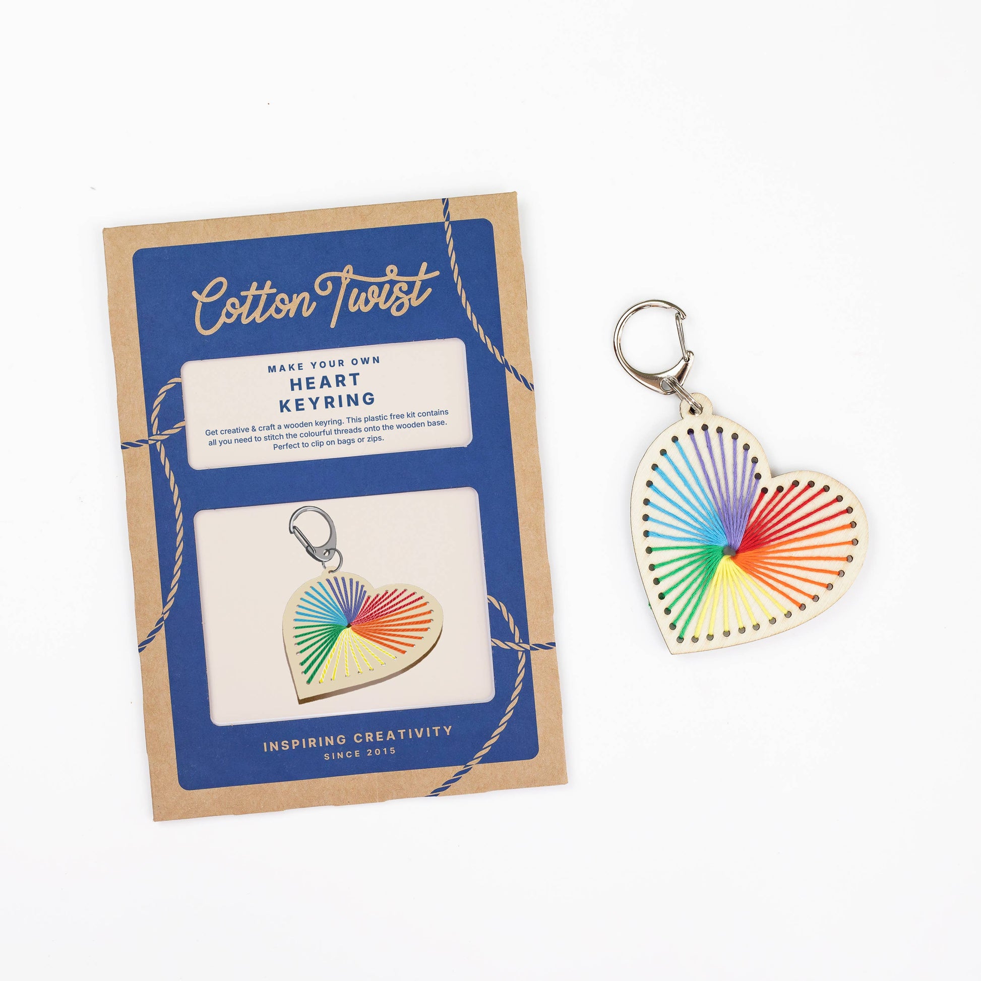 Heart-shaped keyring with rainbow pattern on a Cotton Twist packaging