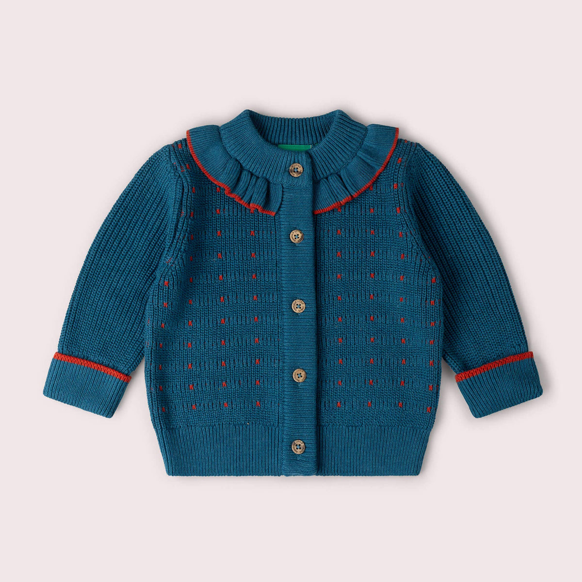 Teal button-front knitted cardigan with a frilled collar, red trim and small colored stitches.