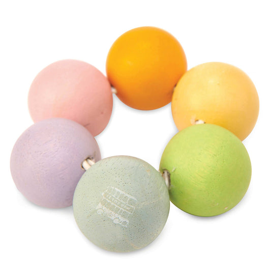 Set of colorful wooden teething beads on a white background