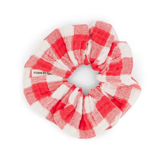 Red and white checkered scrunchie on a white background