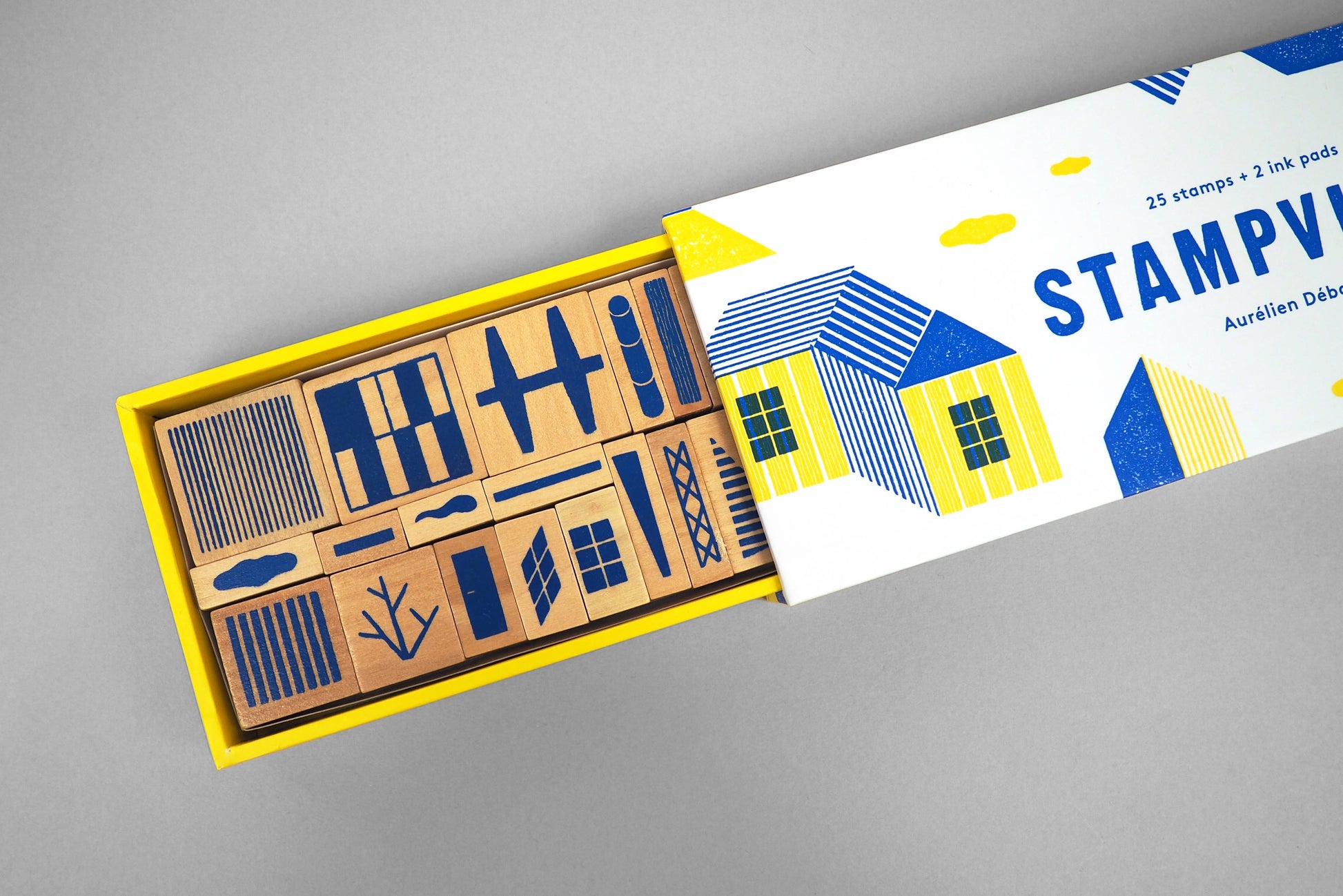 Set of rubber stamps in a yellow box with a 'STAMPVille' branded box on a gray background