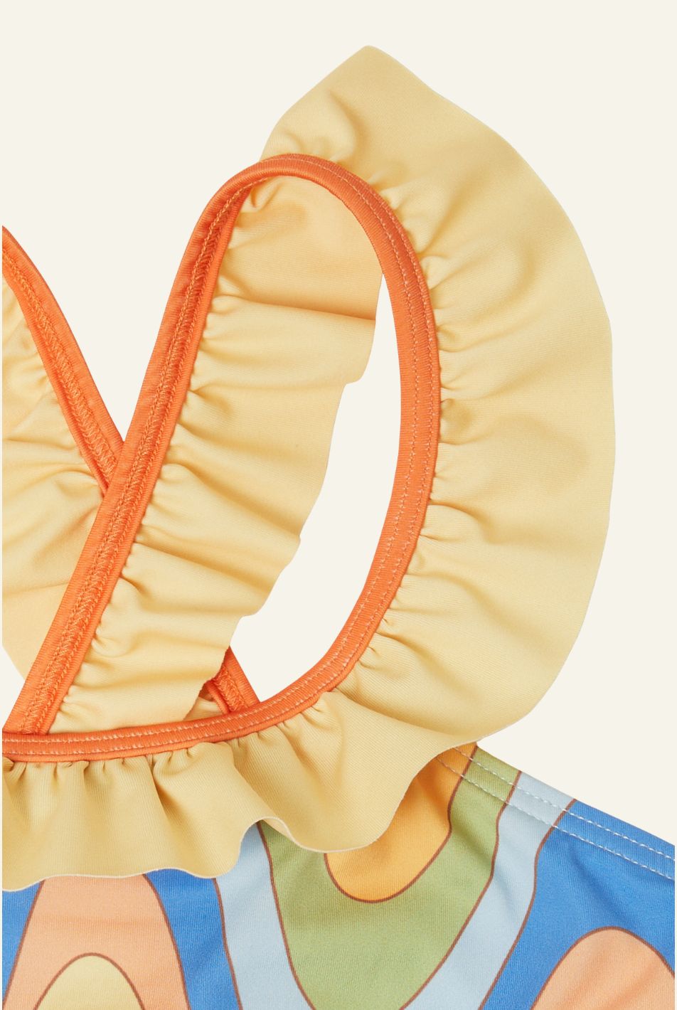 Close-up of a swimsuit top with orange and yellow ruffled straps on a white background