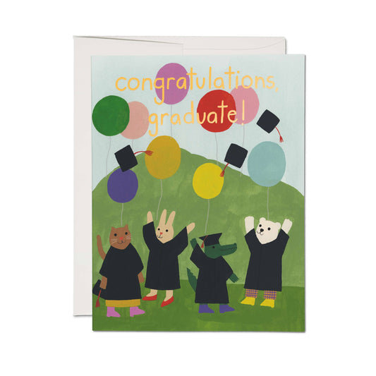 Graduation-themed card with cartoon animals in gowns and caps, colorful balloons, and 'Congratulations graduated!' text.
