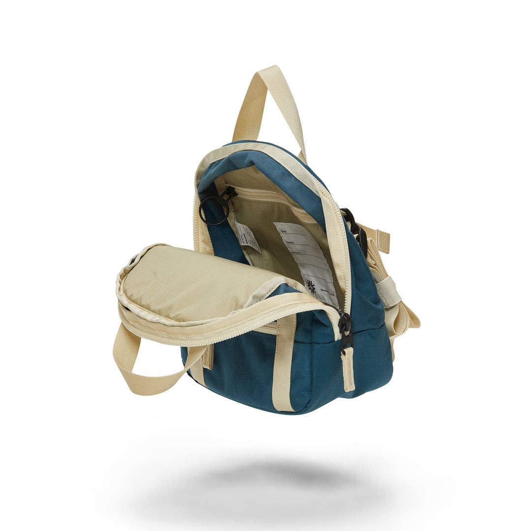 inside view of navy walker goods kids backpack on a white background