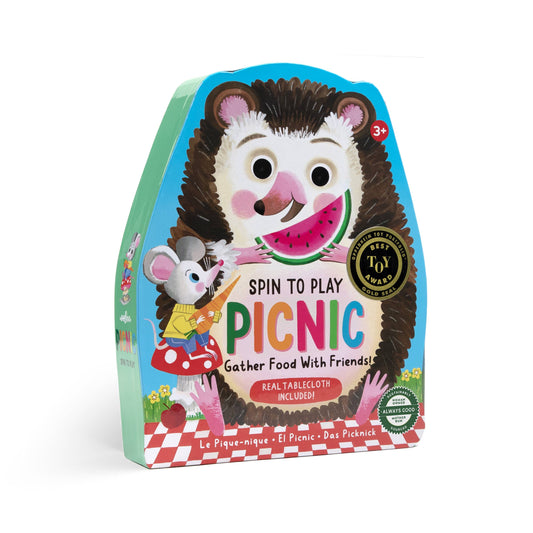 Children's game packaging with hedgehog character and 'Spin to Play Picnic' text on a white background