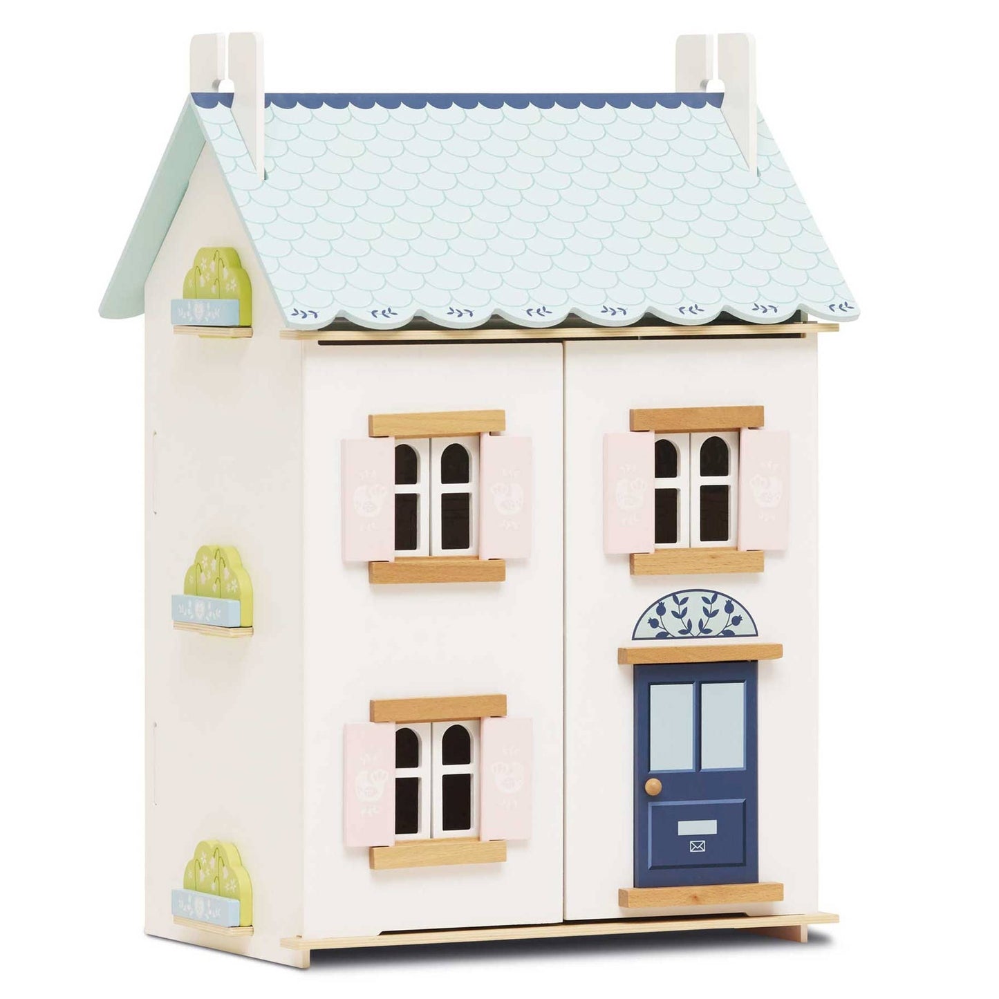 Wooden dollhouse with a blue roof and blue door on a white background