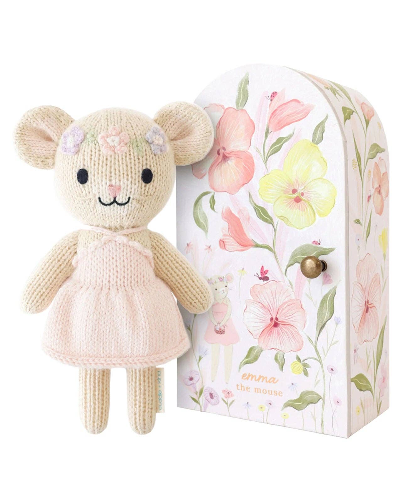Knitted mouse toy with floral packaging on a white background