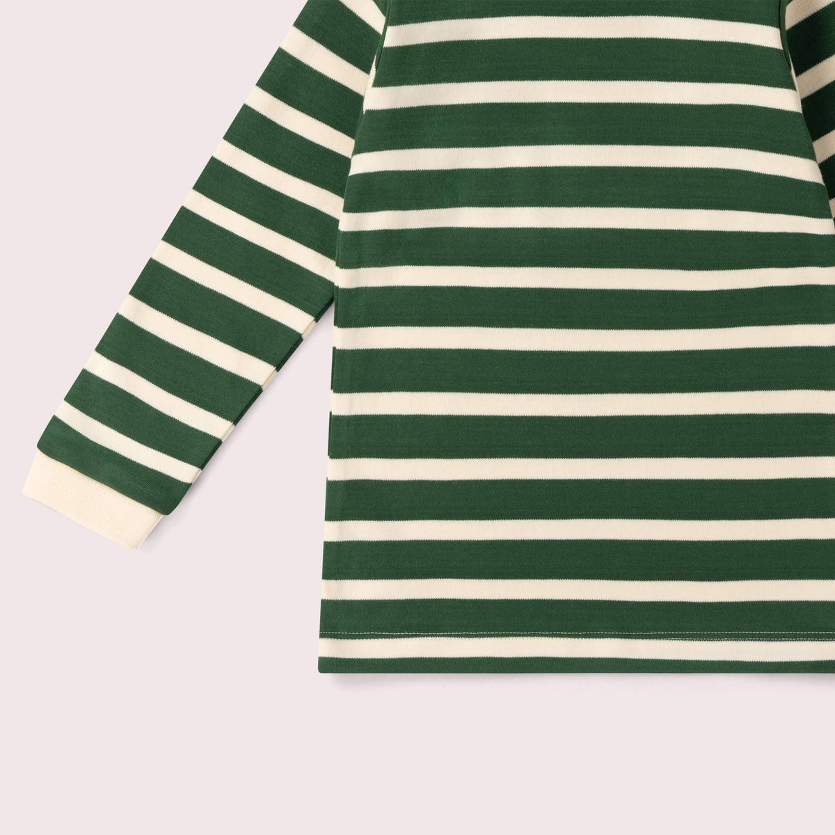 Close-up of green and cream stripes, sleeve cuff and stitched hem on a long-sleeve T-shirt.