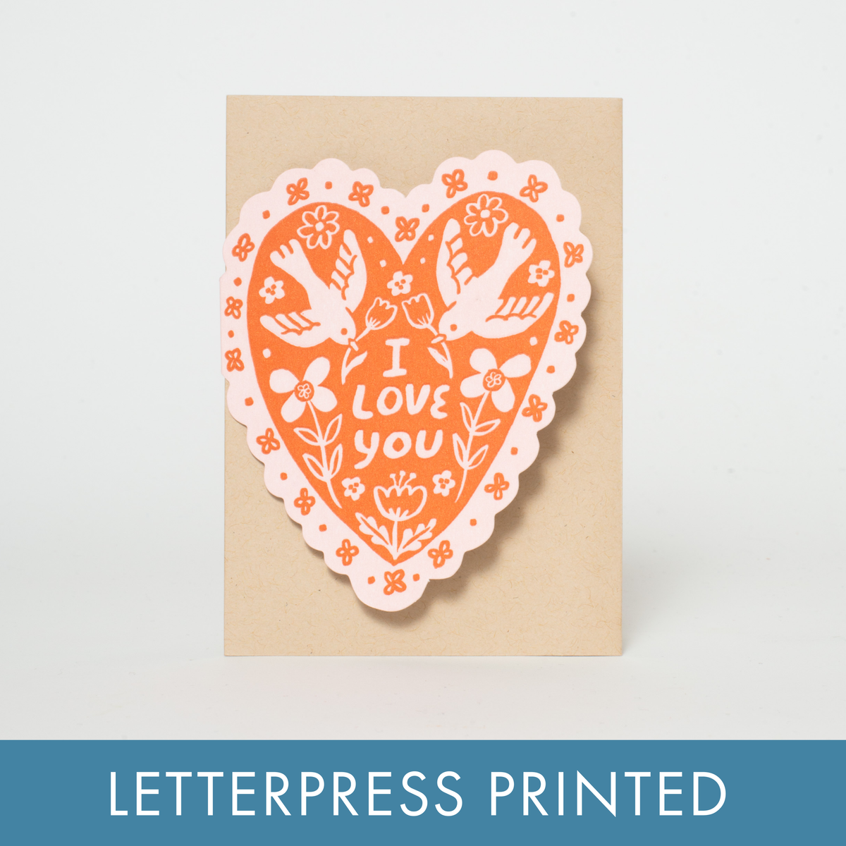 A love or Valentine's Day greeting card in a heart shape with dainty bird illustrations. Letterpress printed and packaged with a kraft paper envelope. 