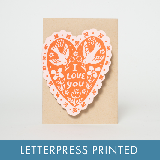A love or Valentine's Day greeting card in a heart shape with dainty bird illustrations. Letterpress printed and packaged with a kraft paper envelope. 