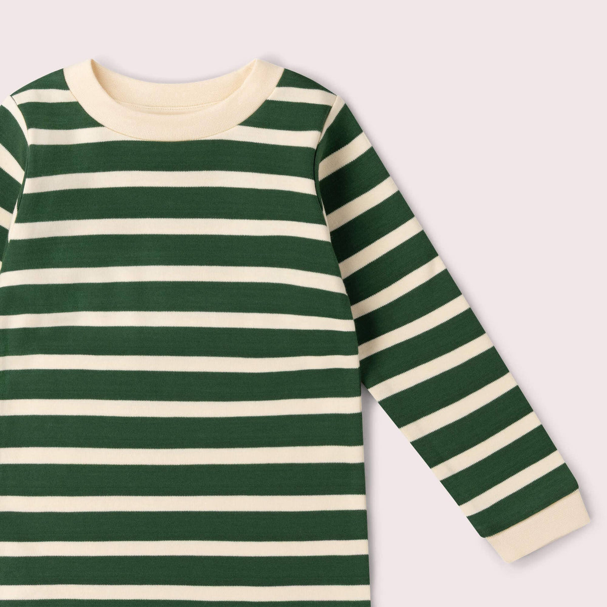 Detail of the cream crew neckline and long sleeve on a green striped T-shirt.