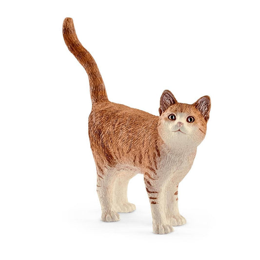 Cat figurine with brown and white fur on a white background