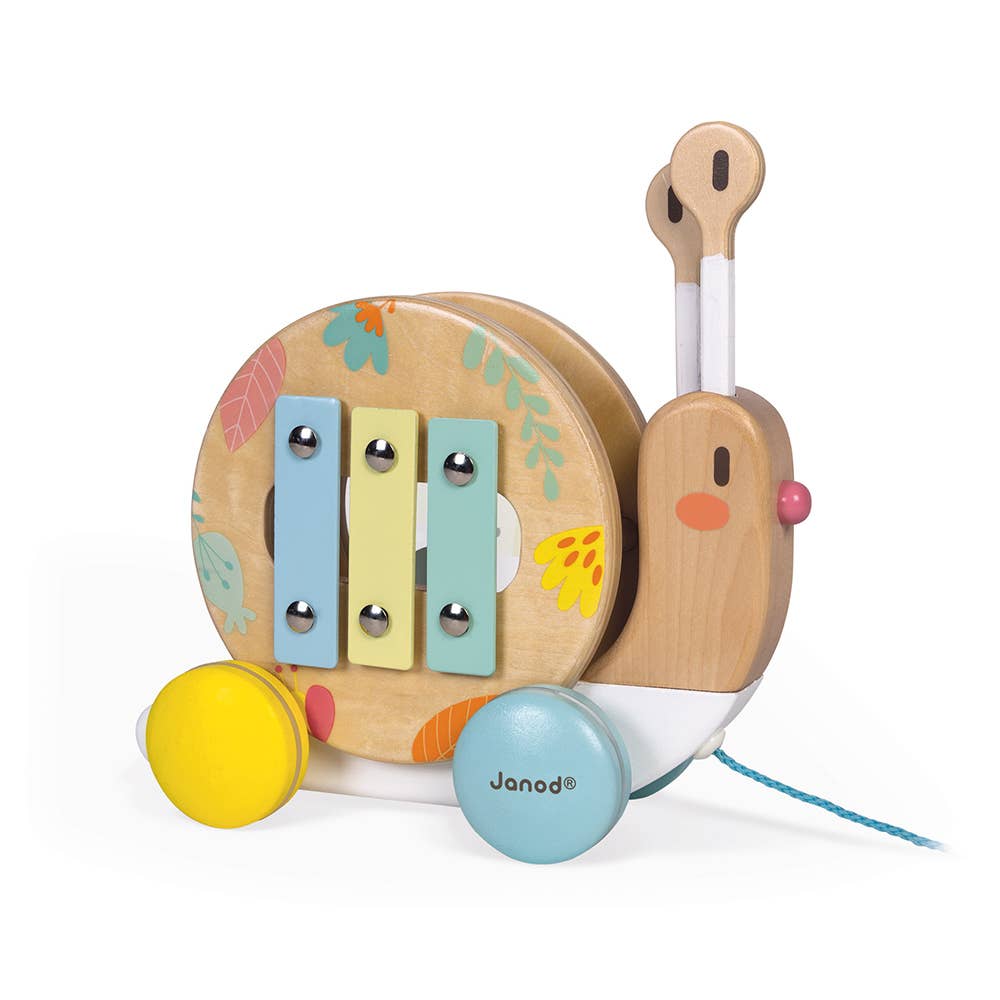 Wooden toy snail with xylophone on a white background, featuring the brand 'Janod'.