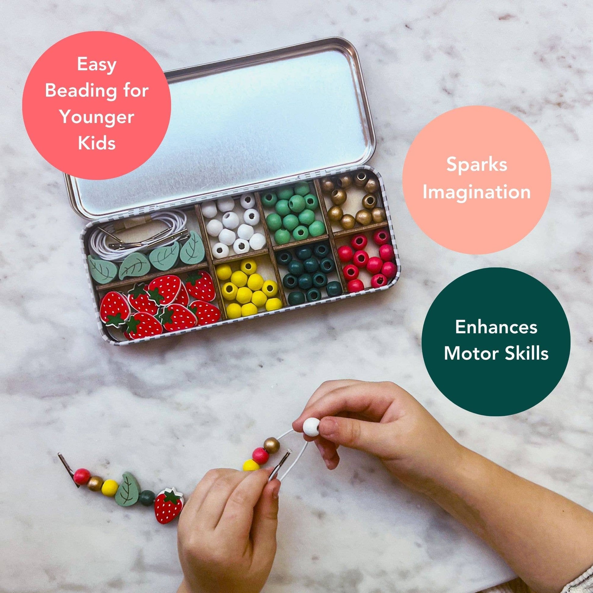 Bead kit with colorful beads and a child's hands working on a bead project on a marble surface. "Easy Beading for Younger Kids, Sparks Imagination, Enhances Motor Skills"
