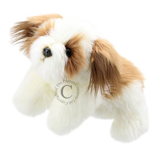 Plush dog puppet toy with brown and white fur on a white background