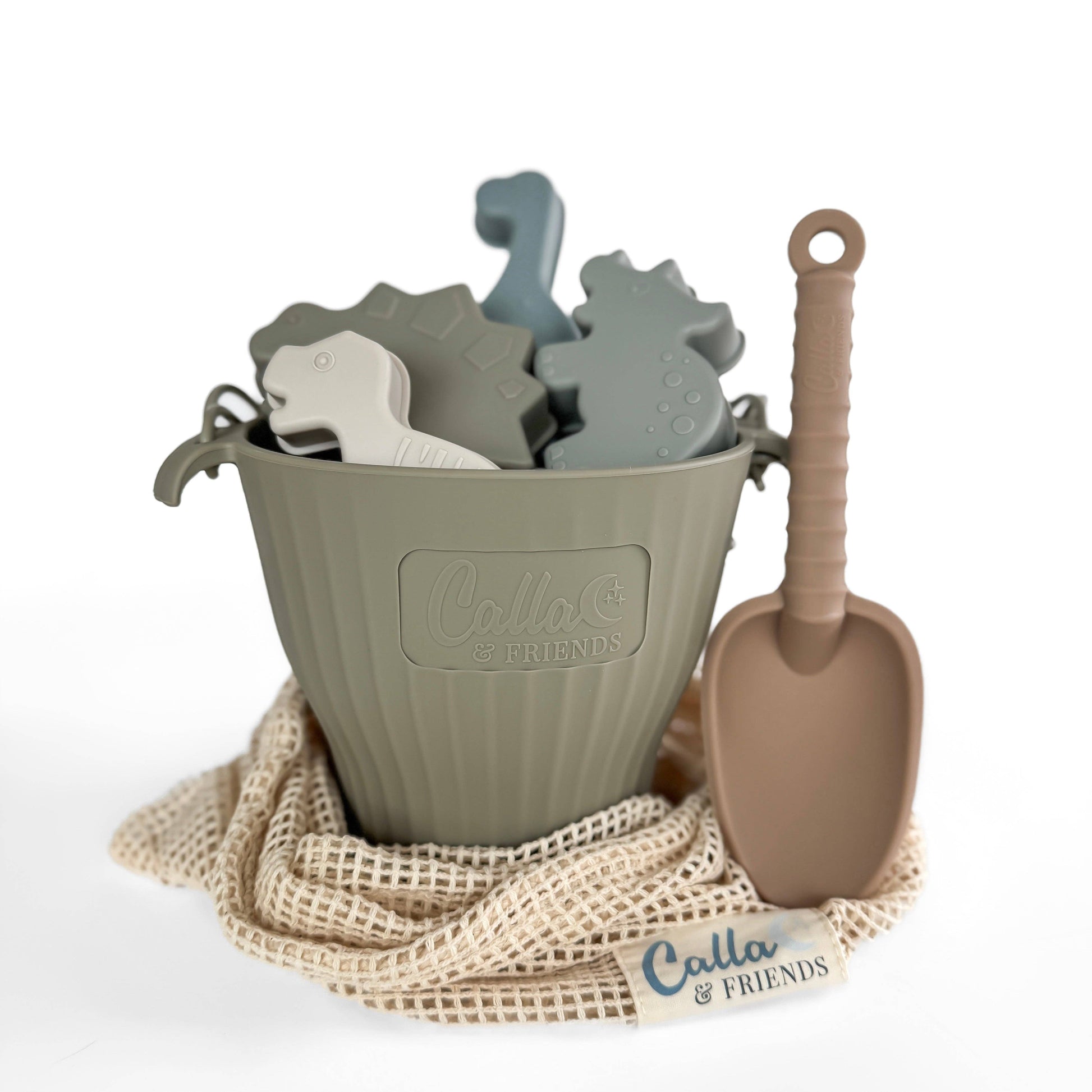 Children's sand toys including a bucket, shovels, and molds with 'Cala & Friends' branding on a white background.