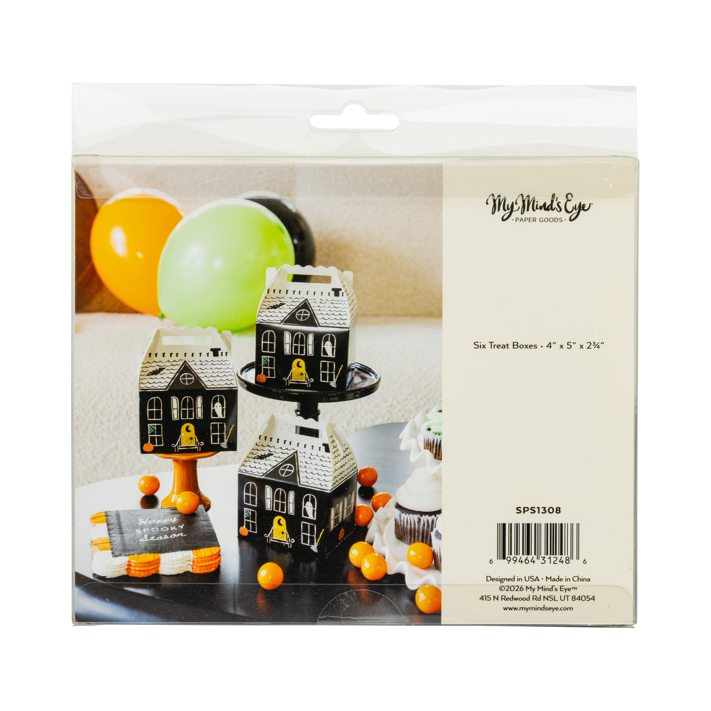 Packaging of haunted house-shaped treat boxes with balloons on a white background