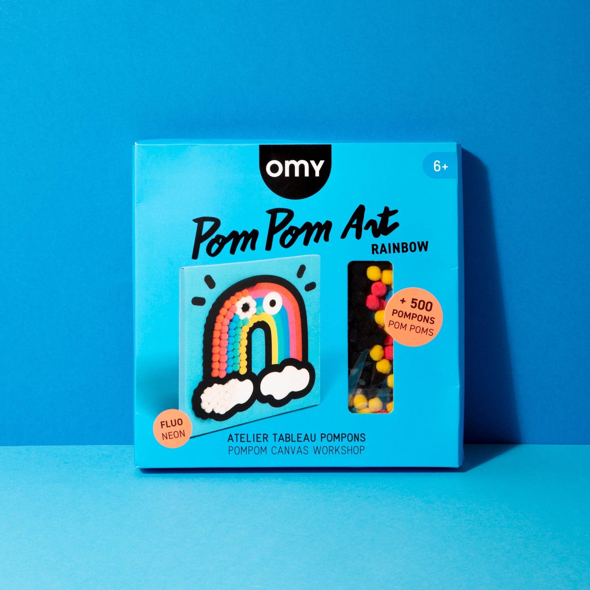 Pom Pom Art Rainbow kit packaging on a blue background