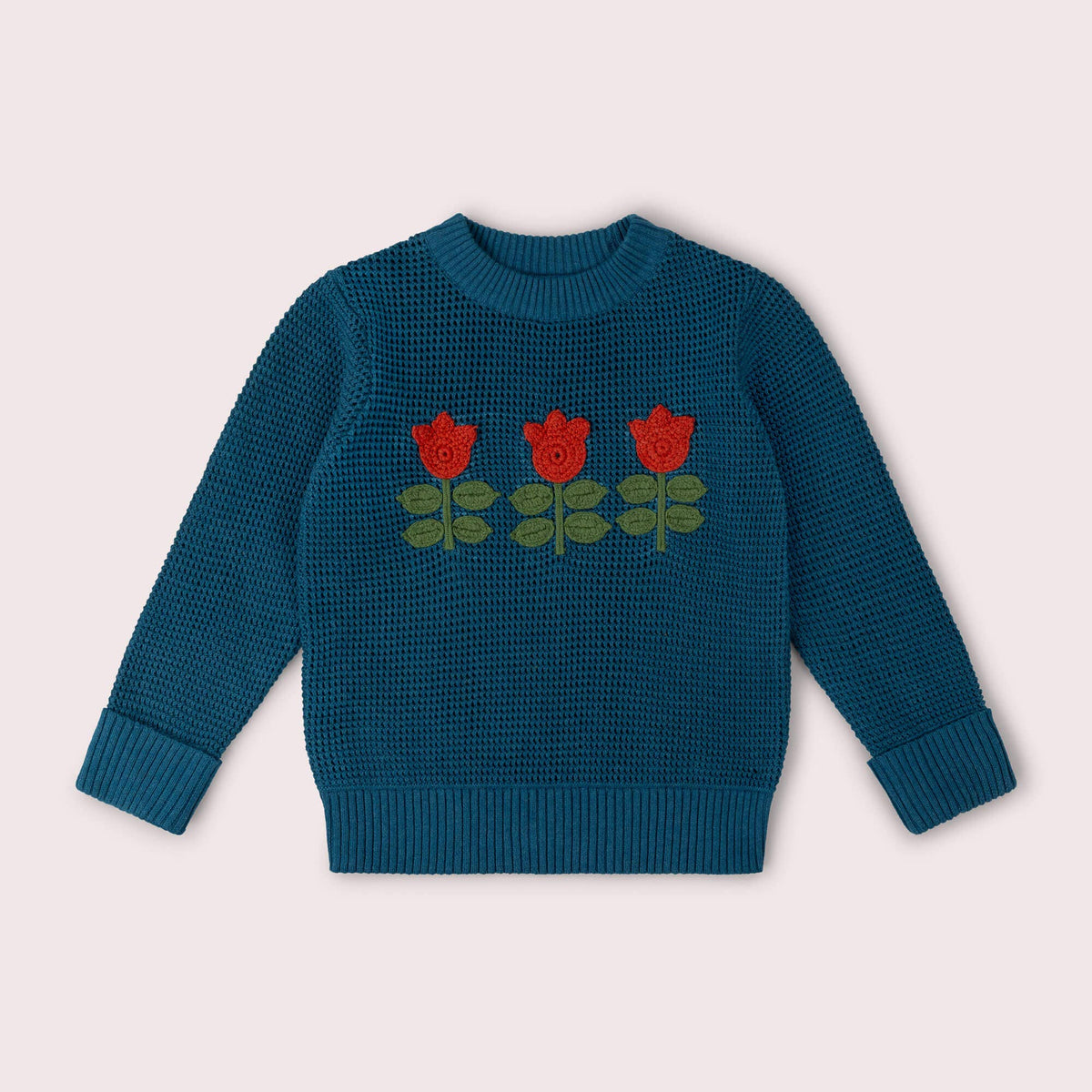 Teal knitted jumper with three red tulips and green leaves across the chest.