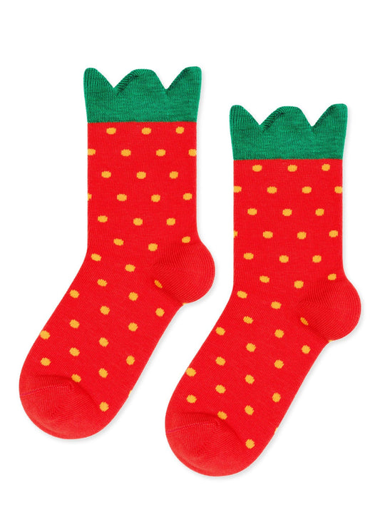 Red socks with green tops resembling strawberries on a white background