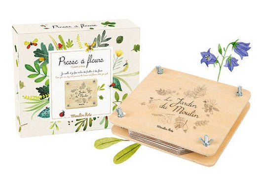 Wooden plant press with floral design packaging on a white background