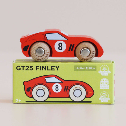 Wooden toy car with 'GT25 Finley' packaging on a light beige background