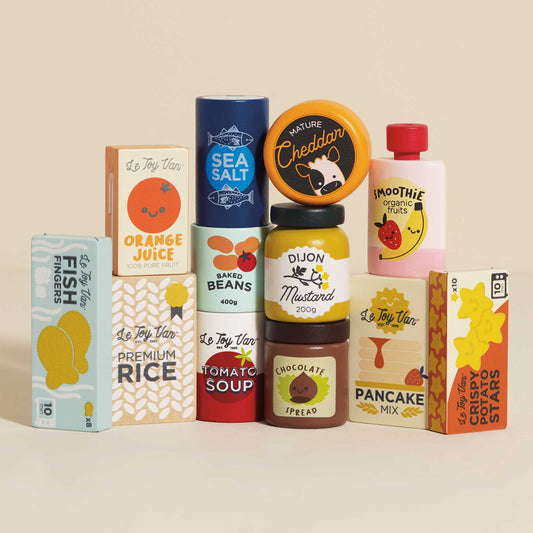 Assorted wooden play packaged food toys on a beige background