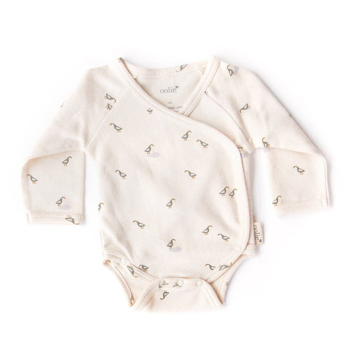 Baby onesie with small patterns on a white background