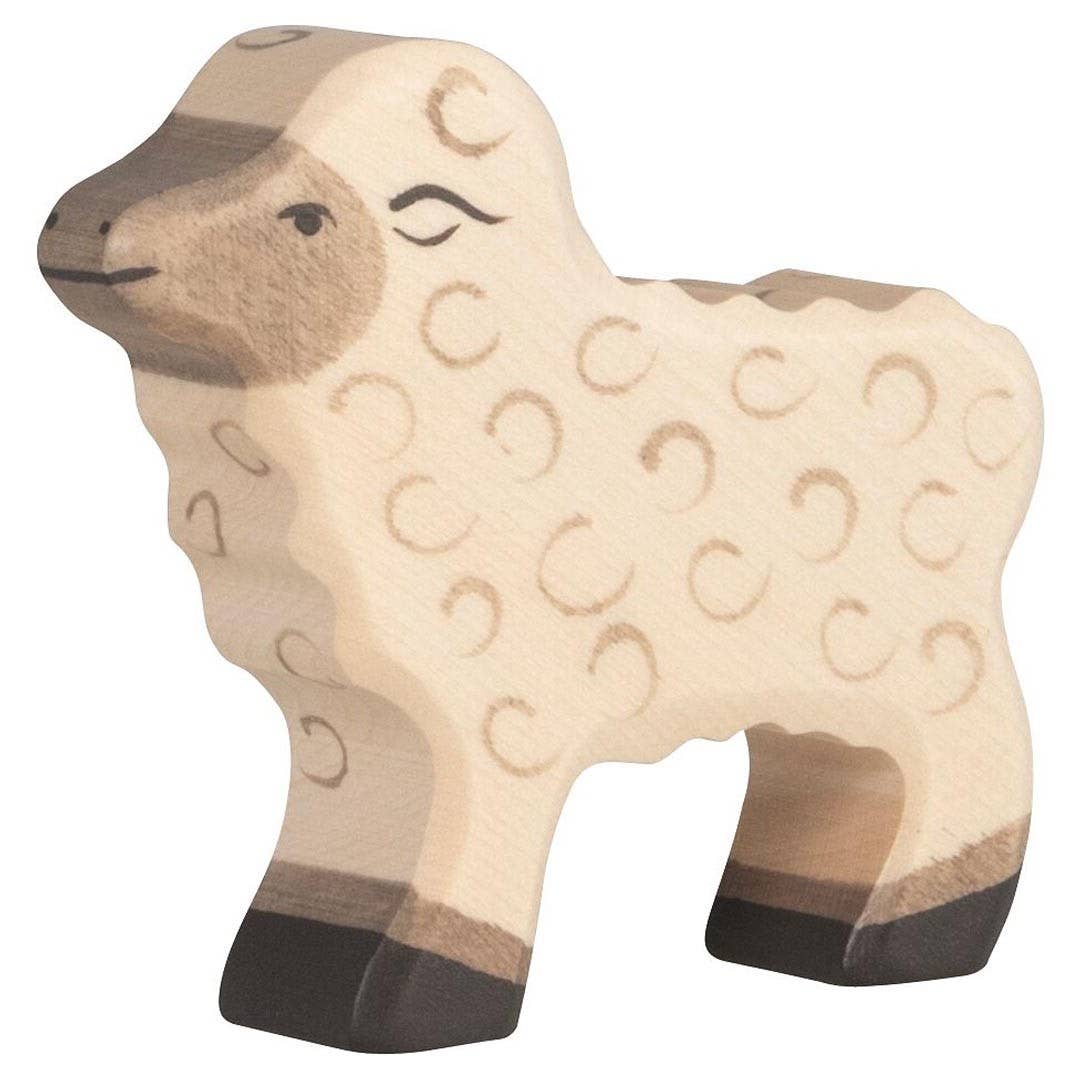 Wooden sheep figurine on a white background