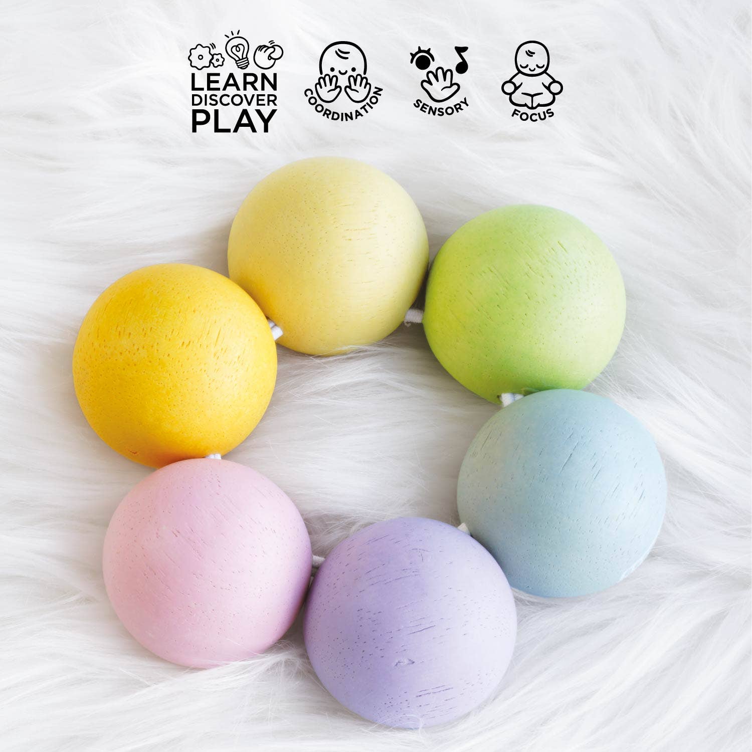 Pastel-colored wooden teething balls strung together, on a white surface with educational icons and text.