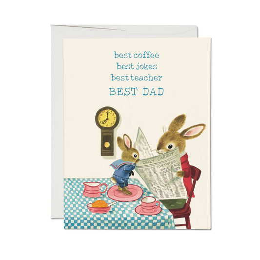Greeting card with two bunnies at a table, one reading a newspaper and the other looking at a clock, with text 'best coffee, best jokes, best teacher, BEST DAD'.