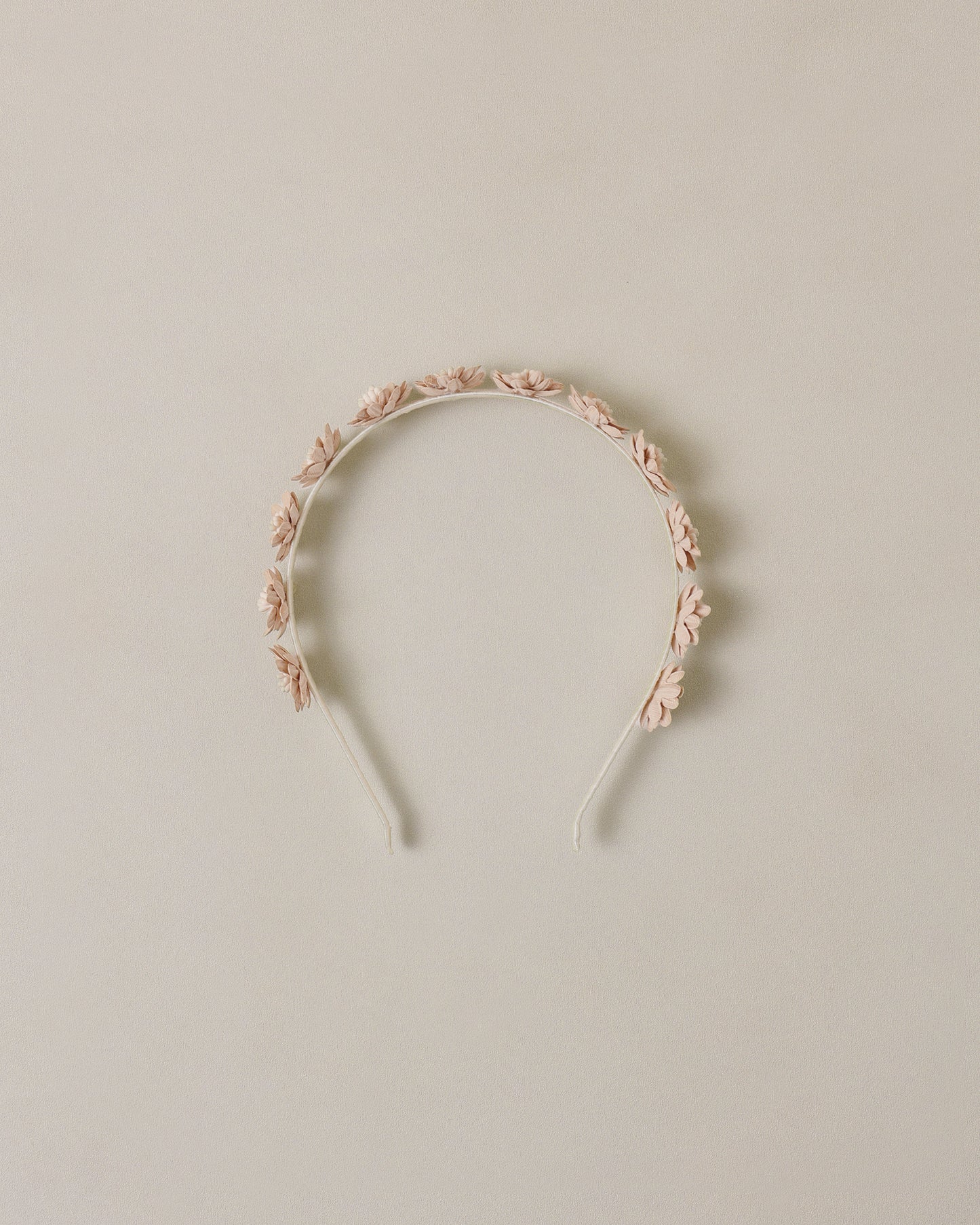 Floral headband on a beige background
