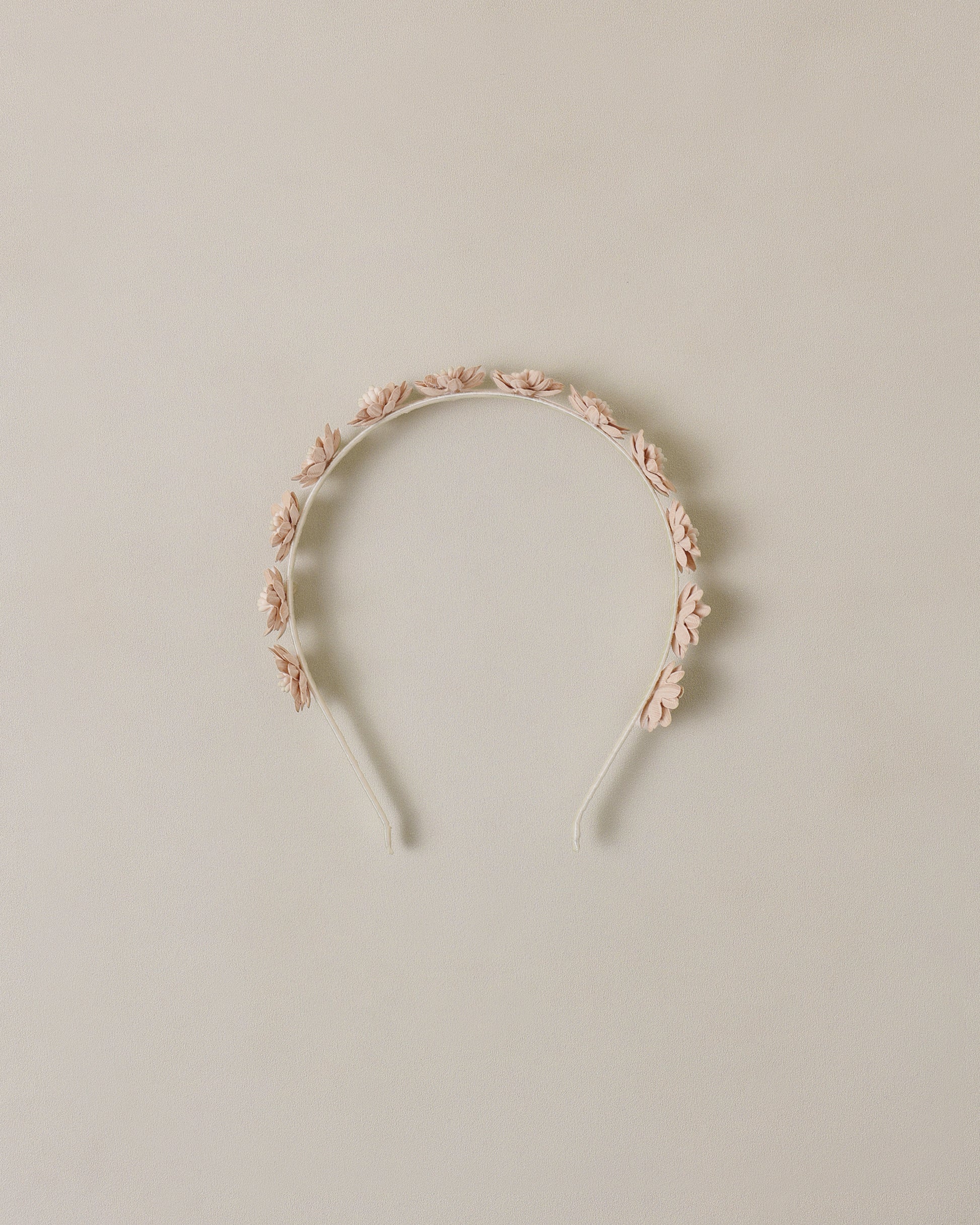 Floral headband on a beige background