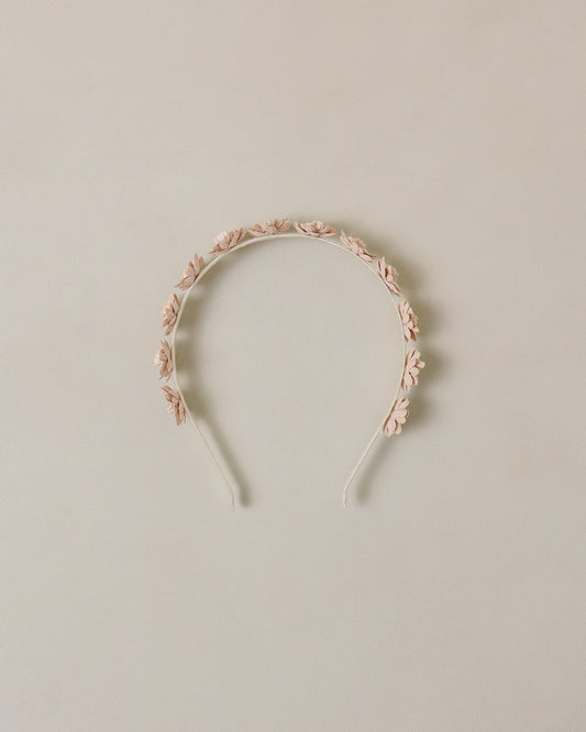 Floral headband on a beige background