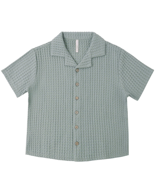 Sea green textured shirt on a white background